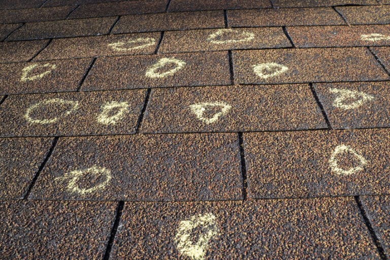 roof with circles marking hail damage